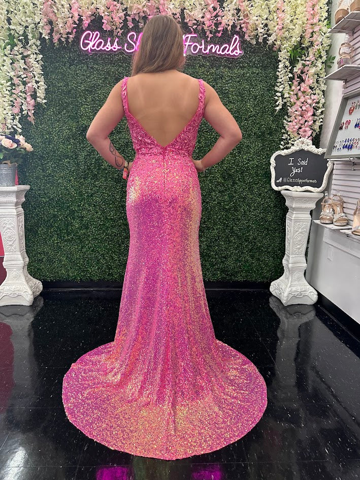 Expertly crafted by Jovani, the JVN36580 Prom Dress is a stunning masterpiece. With a sheer lace V-neck, sequin detailing, and a thigh-high slit, this formal evening gown exudes elegance and sophistication. Perfect for any formal occasion, this dress is sure to make a statement. Sizes: 10 Colors: Hot Pink