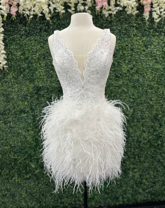 Johnathan Kayne 2314 Cocktail Dress. This is a short lace V neckline cocktail dress with scalloped edges in the neckline. The skirt is feathers. Strut in your next event or pageant in this fun cocktail dress. Colors: White size 6, 8 Fabric: Stretch Lace, Stretch Lining