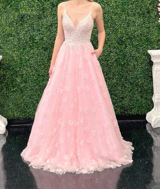 This Pink Sequin Lace Shimmer Ballgown by Johnathan Kayne features high quality sequin detailing on the bodice and skirt to create a dramatic and eye-catching look. The sleeveless bodice has a modest neckline, while the floor-length skirt adds elegance and movement for the perfect prom dress. 3d Floral Tulle Appliques and sequins cascading down the skirt. *** One of A KIND! Size: 2 Color: Pink