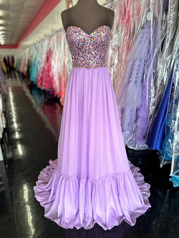 Elevate your evening with the Johnathan Kayne 2612, a size 4 aqua long A-line gown that exudes elegance. This strapless prom dress features shimmering sequins and delicate ruffle details, creating a graceful silhouette perfect for pageants or formal events. Its refined design combines classic charm with modern sparkle, ensuring you stand out with sophistication and poise.
Size: 4
Colors: Lilac