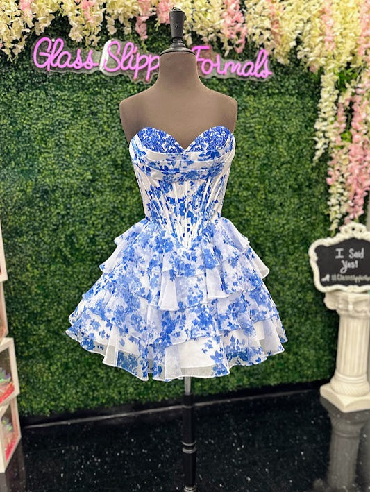 Jovani 48771 vibrant blue floral print short dress in size 4 features delicate ruffles with lace accents on the corset