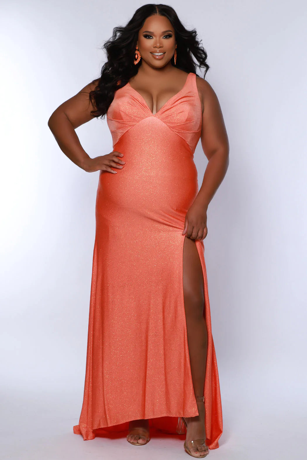 This Sydneys Closet SC7369 Plus Size Prom Dress will make you look amazing at your formal event. It features a stunning V neckline, with an elegant ruched back and a slit train. The fabric is comfortable and the slim fit is designed to flatter curves. Make a lasting impression at your special event! 