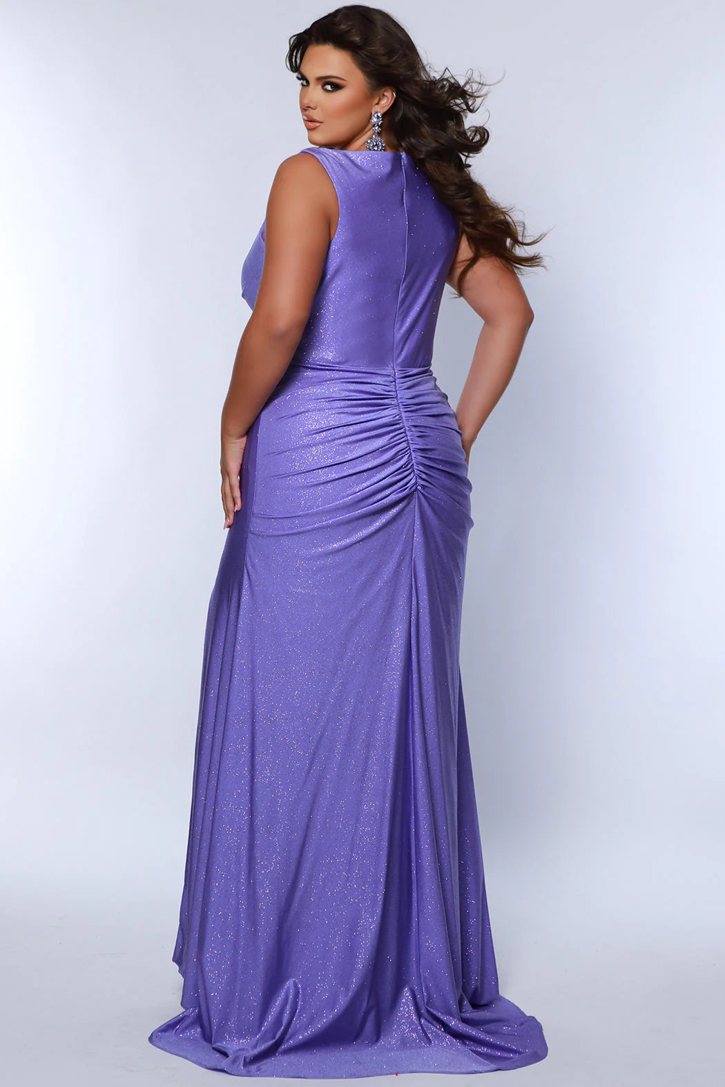 This Sydneys Closet SC7369 Plus Size Prom Dress will make you look amazing at your formal event. It features a stunning V neckline, with an elegant ruched back and a slit train. The fabric is comfortable and the slim fit is designed to flatter curves. Make a lasting impression at your special event! 