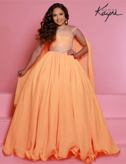 Sugar Kayne C329 Tangerine Pageant Dress features a chiffon skirt, semi sweetheart neckline encrusted with rhinestones and wide straps with a cape.