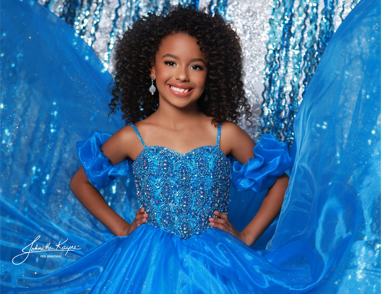 Dazzle on stage with the Sugar Kayne C359 pageant ballgown dress. Featuring a sweetheart neckline, puff sleeves, and spaghetti straps, this dress will make you stand out. With an embellished bodice and a glitter tulle and organza long skirt, you'll sparkle and shine like a true pageant queen.
Colors: Capri Blue, Rose Pink, White, Purple, Red
Sizes: 2-16