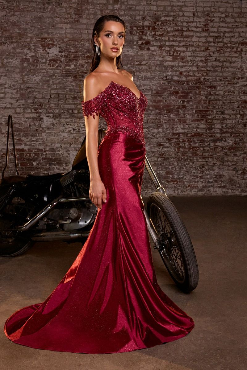 Elevate your prom night with the Ladivine CC456, a stunning off-the-shoulder gown that commands attention. This exquisite dress features intricate beaded lace detailing and a structured corset bodice that flatters your silhouette. The sweetheart neckline and dramatic train create an unforgettable entrance, while glitter satin fabric catches the light with every movement. Perfect for those seeking a show-stopping formal look that balances elegance with glamorous embellishment.
Silhouette: Fitted
Design