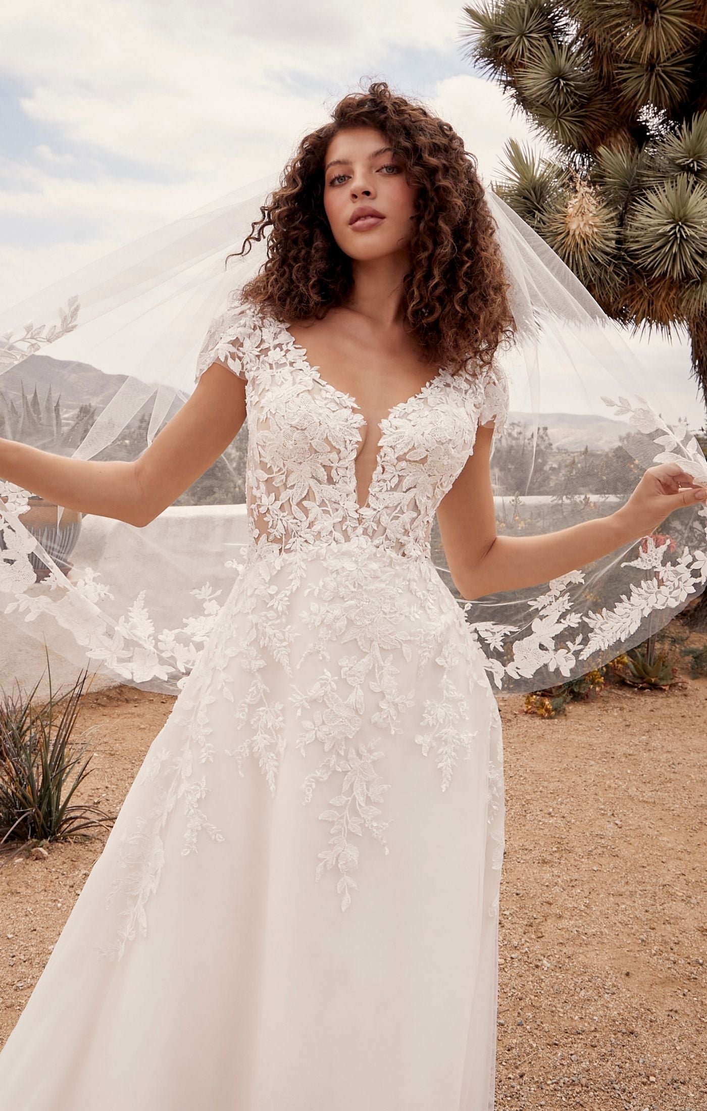 Casablanca Beloved BL435Rusty A-Line Low Back Cap Sleeves V-Neck 3D Appliques Floral Embroidered Train Wedding Gown. Embodying all things romance, Rusty is for the bride who wants to feel like she’s floating on cloud nine. Her A line shape with layers of organza, beaded floral lace and luxurious lining make this dress so divine to wear.