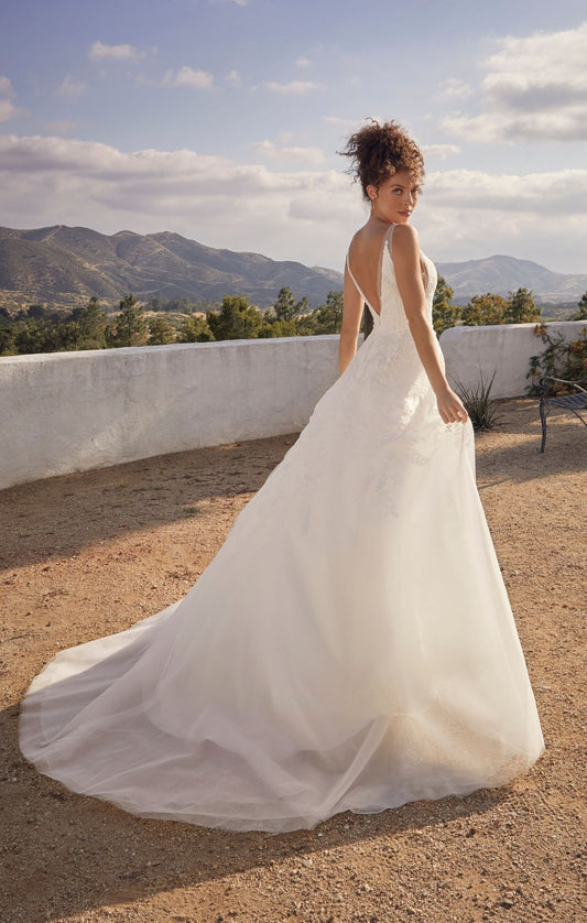 Casablanca Beloved BL431 Janie A-Line Ballgown V-Neck Floral Lace Train Wedding Gown. Reminiscent of storybook romance, exceptionally sweet Style BL431 Janie is a treasure to behold. Crafted with meticulous attention to detail, Janie features a delicate lining that ensures a comfortable fit, allowing you to move with ease. The combination of organza, tulle with floral lace, and sequins creates a breathtaking effect, adding depth and dimension to the gown