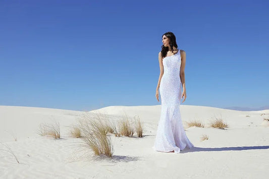 Vienna Prom 8861 One Shoulder Sequined Prom Dress with the shoulder strap flowing across the open back. This evening gown is covered with sequins and is a mermaid style.