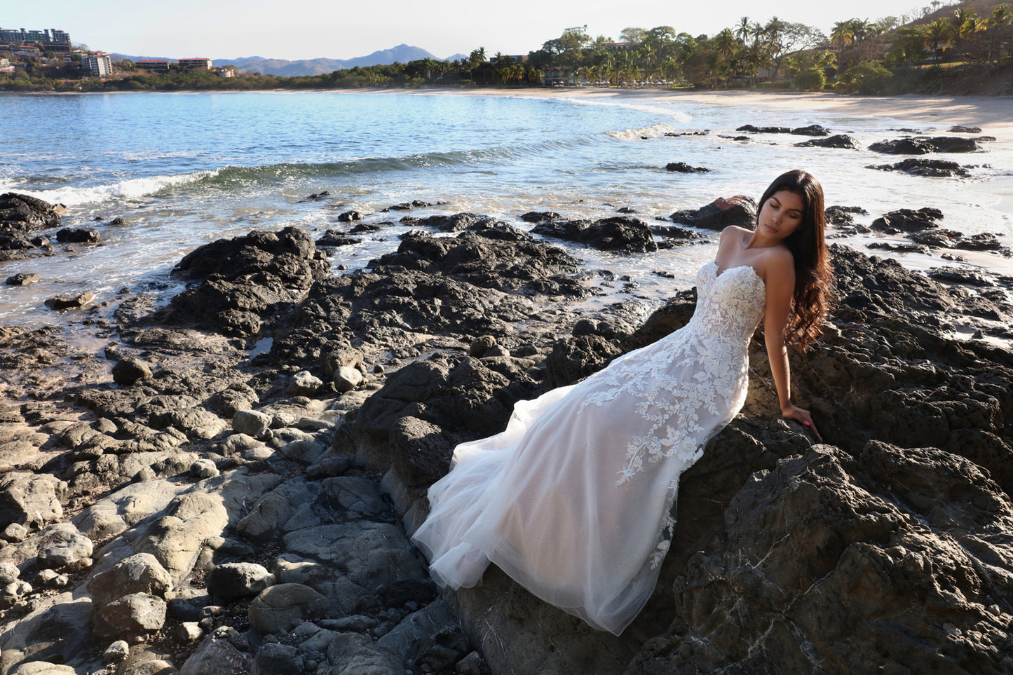 Davinci Bridal 50668 is an A Line formal wedding dress. Featuring a fitted bodice with off the shoulder sheer removable straps and sweetheart neckline. Floral lace embellishments over a sequin shimmer ballgown skirt with train. Lace up corset back. Available Sizes: 2-20 Available Colors: Ivory/Ivory, Ivory/Latte, White/White