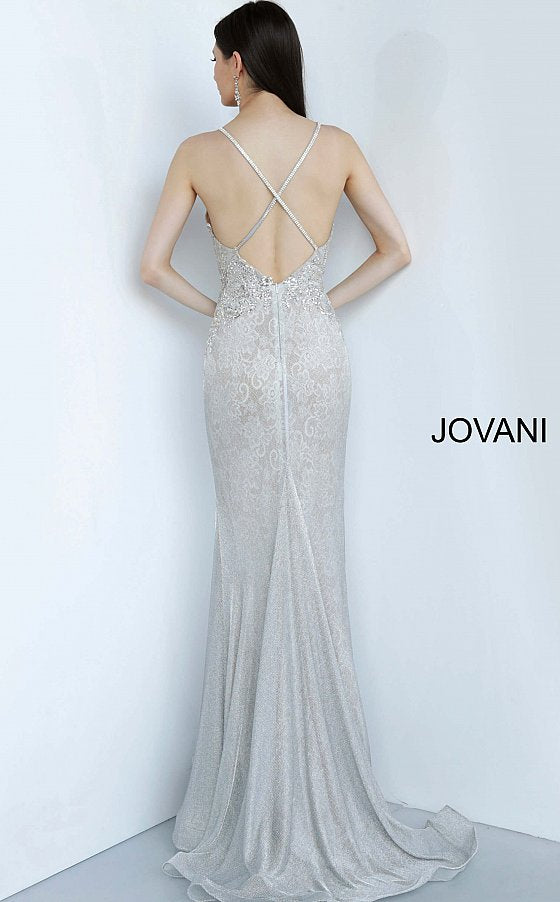 Jovani 03167 is a 2021 Prom Dress, Pageant Gown & Formal Evening Wear. Details: Silver lace dress, fully lined, form fitting silhouette, floor length, embellished Spaghetti strap bodice, plunging neckline with mesh insert for support, open back with embellished criss cross straps. Available Sizes: 00,0,2,4,6,8,10,12,14,16,18,20,22,24 Available Colors: Silver