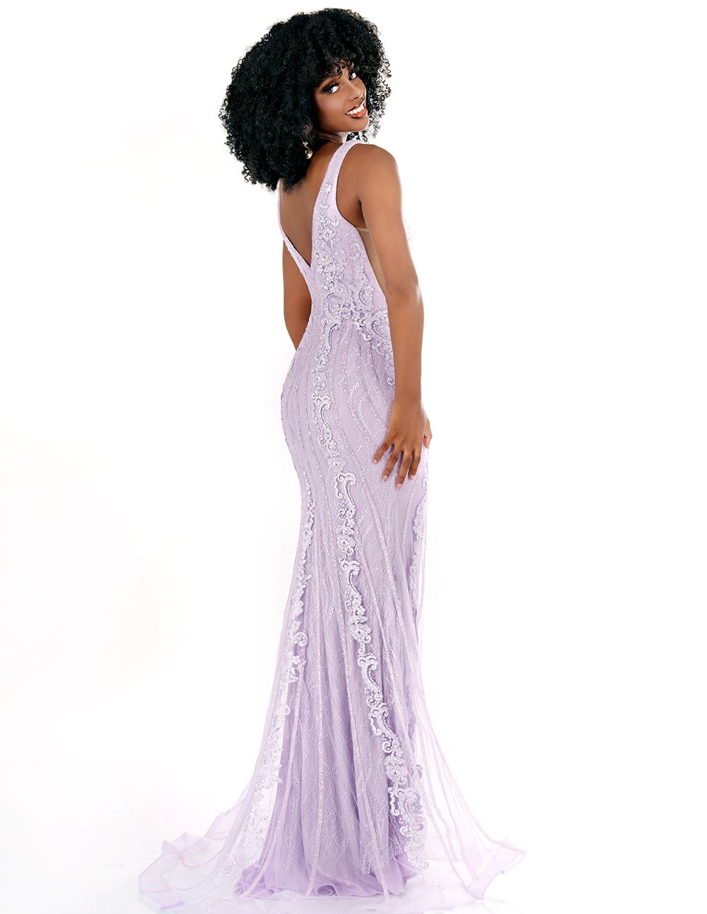 Experience the elegance of this lip-pleated "Cecilia Couture 1570" evening gown made from a high-quality sequin-sparkle fabric. It is a long fitted dress with a V-neck design, featuring a lace-embellished bodice and ruched waistline. It is perfect for your next special event! Sizes: 0-20 Colors: Lilac, Champagne