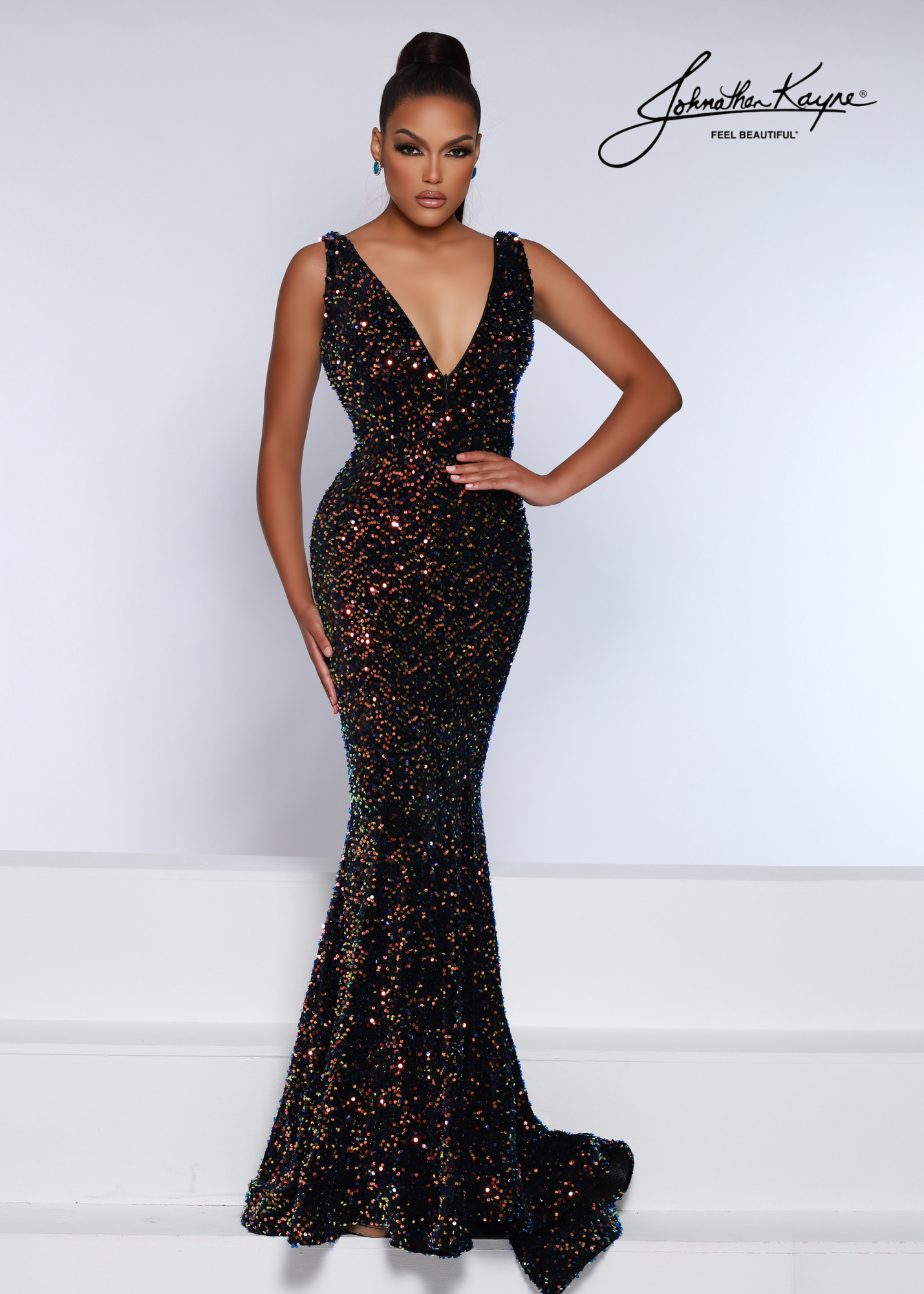 Johnathan Kayne 2655 Long Fitted Velvet Sequin Formal Prom Dress Pageant Gown V Neck Seriously stunning! This sequin velvet gown features an invisible zipper in the bodice to control the neckline. The fit-and-flare silhouette embraces all your curves Sizes: 00-24 Colors: Multi, Power Blue, Royal-AB, Strawberry