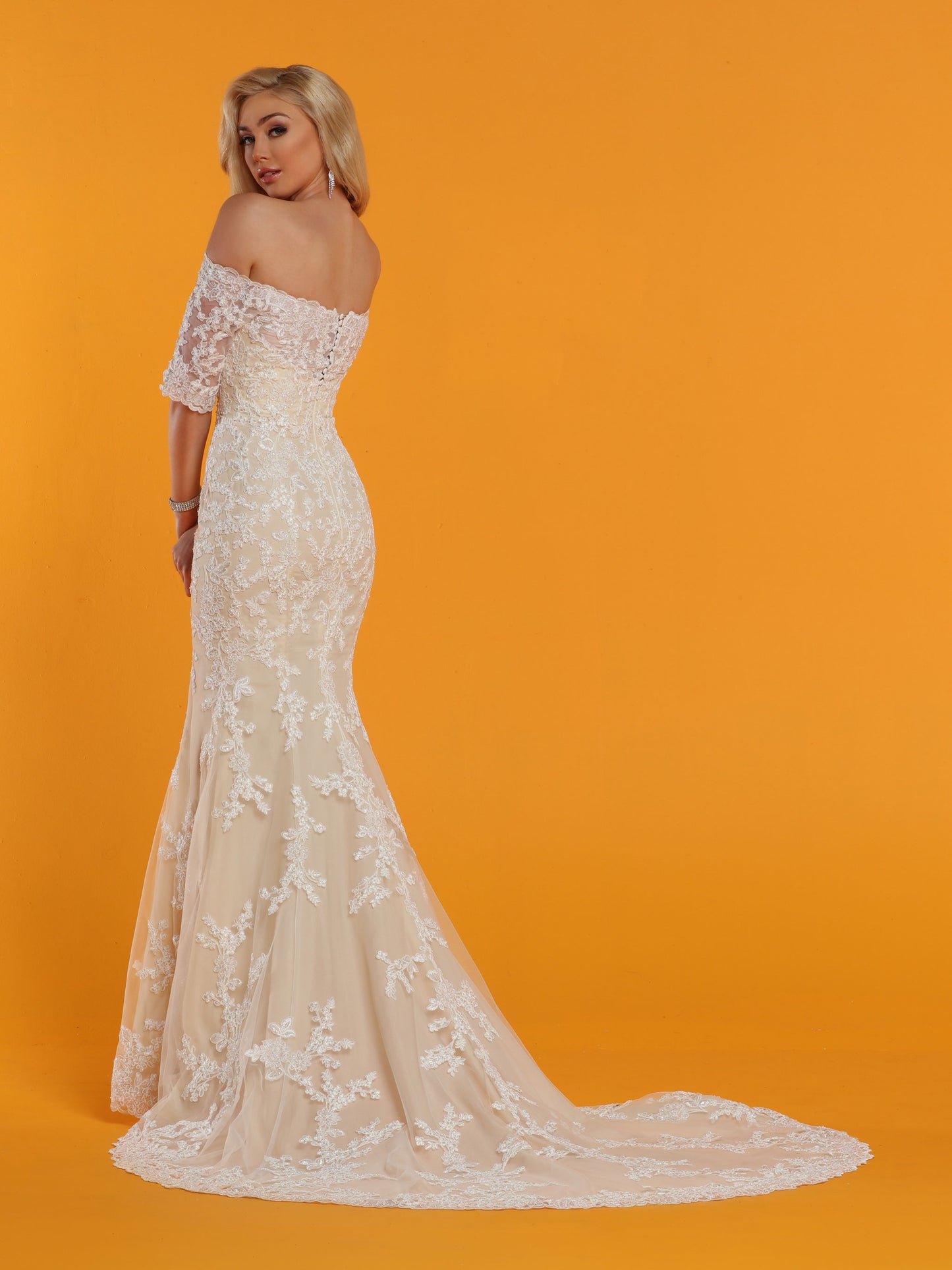 Davinci Bridal 50529 is a long Fitted Mermaid Silhouette wedding dress. Featuring an Illusion sweetheart neckline with sheer lace straight off the shoulder 1/2 sleeves. The back also features a sheer lace backing. Lace Clustered along the bodice and begins to break up as it cascades down into the skirt. Lace edge hem and train. Available for 1-2 Week Delivery!!! Available Sizes: 2,4,6,8,10,12,14,16,18,20 Available Colors: Ivory/Nude, Ivory/Ivory