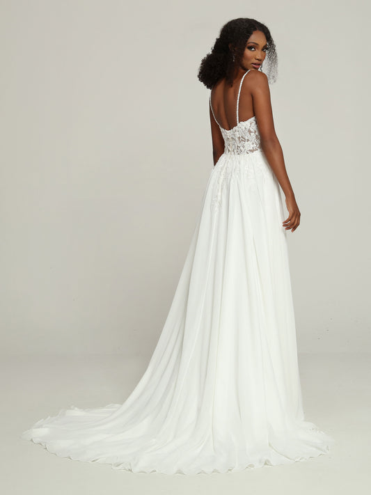 Davinci Bridal 50696 Beaded Sheer A Line Wedding Dress V neck Chiffon Bridal Gown Slender Beaded Shoulder Straps & a Sheer Bodice give this Chiffon A-Line Wedding Dress a Slip Dress Vibe. Lace Applique Highlights the Bodice, V-Neckline & Open Back. The Chiffon Skirt with Chapel Train has Delicate Lace Applique Accents at the Waist.