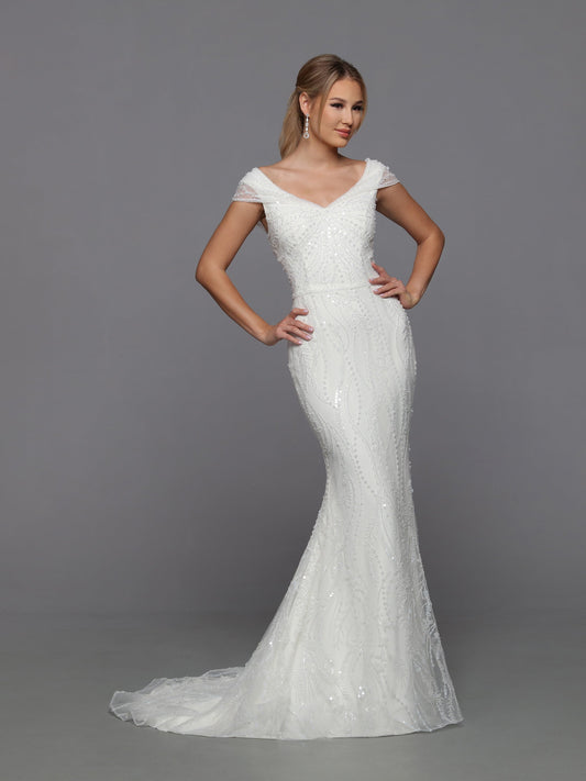Davinci Bridal 50762 Long fitted Beaded Sequin Mermaid Bridal Gown with detachable Overskirt off the Shoulder Cap sleeves and a corset lace up back. Sizes: Ivory Colors: 0-28
