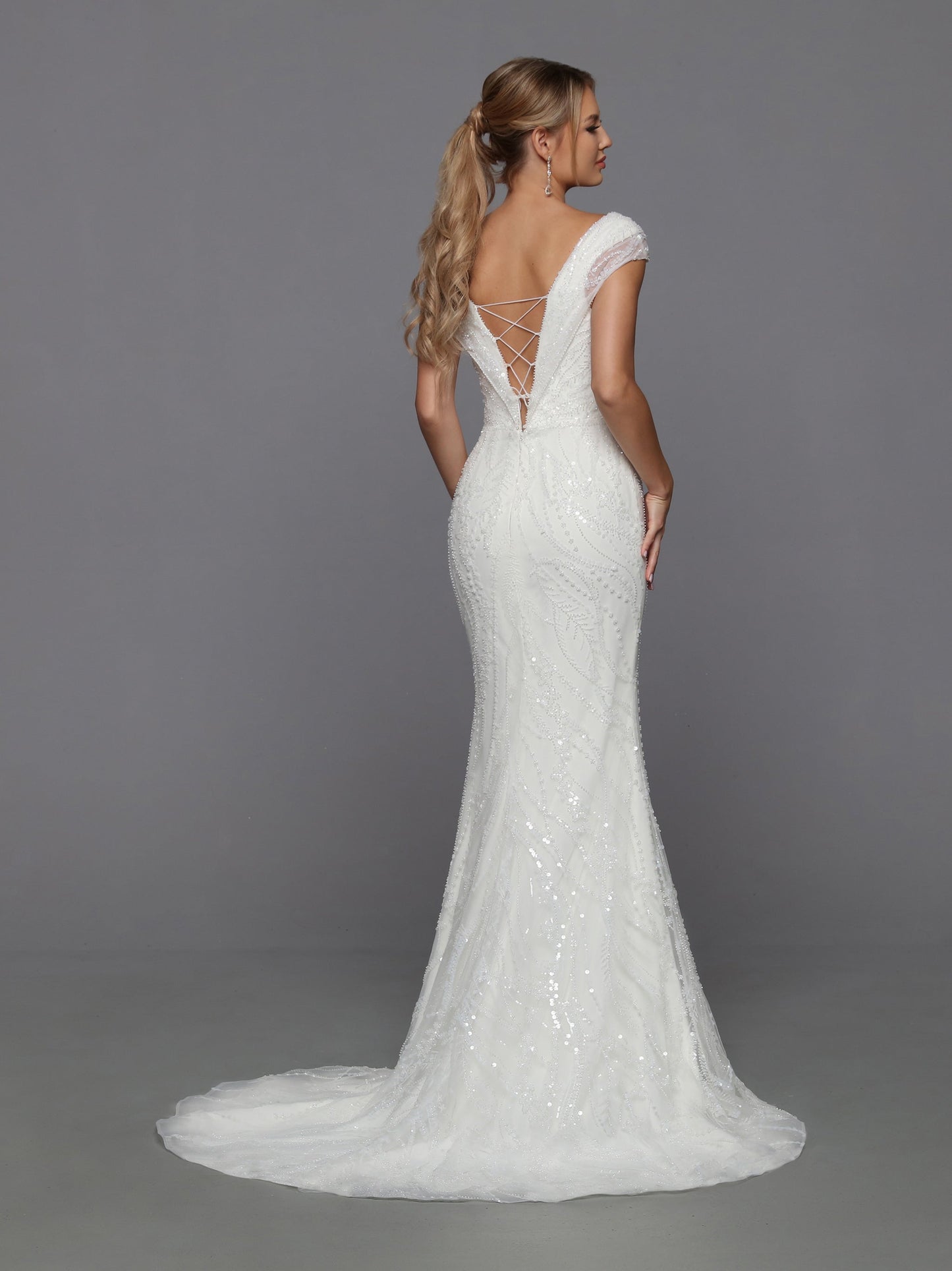 Davinci Bridal 50762 Long fitted Beaded Sequin Mermaid Bridal Gown with detachable Overskirt off the Shoulder Cap sleeves and a corset lace up back. Sizes: Ivory Colors: 0-28
