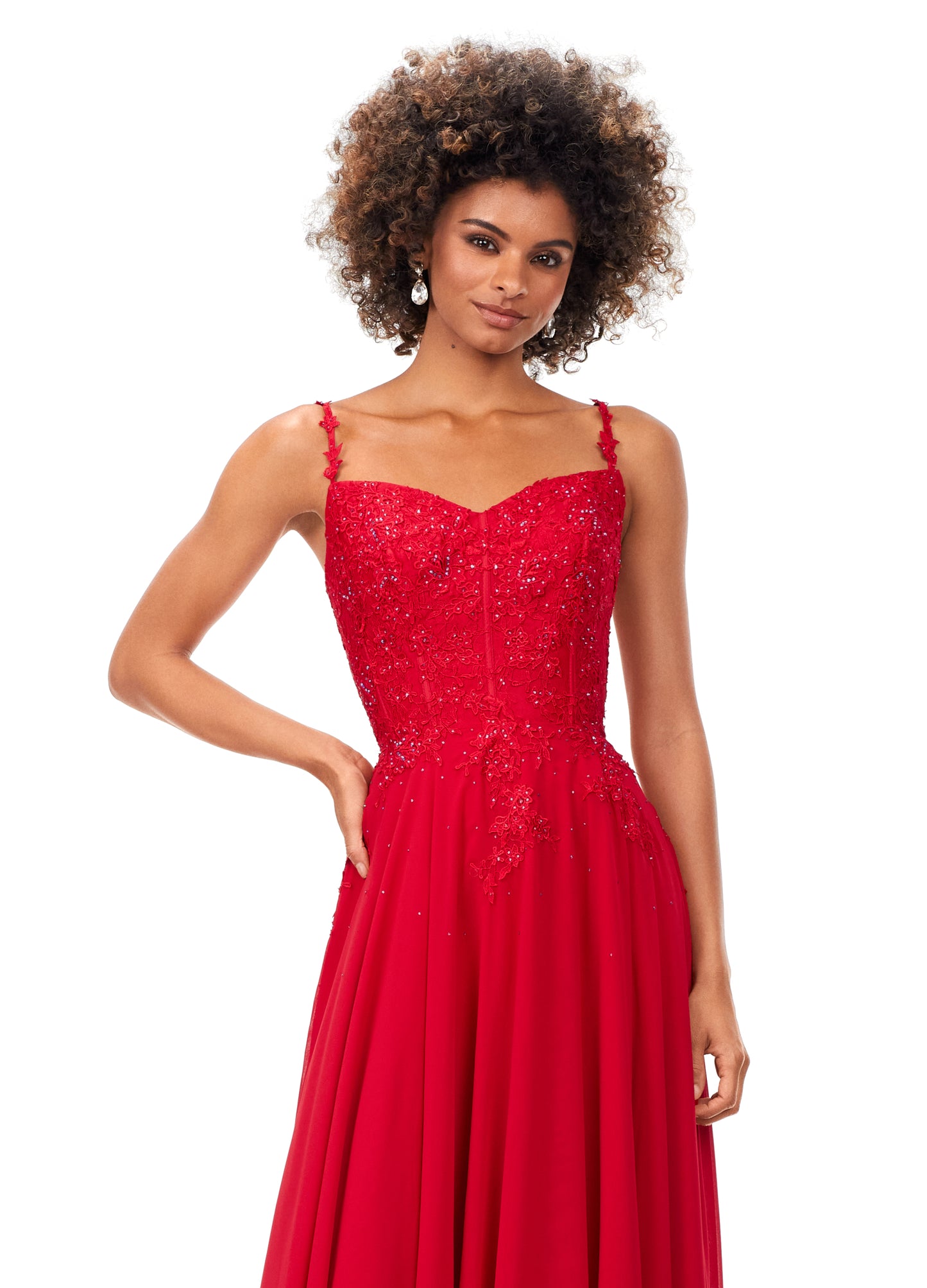 Ashley Lauren 11332 This classic chiffon prom, pageant and evening dress features a sweetheart neckline with spaghetti straps. The bustier on this dress is a corset style with lace appliques throughout. The lace appliques carry down onto the a-line skirt.