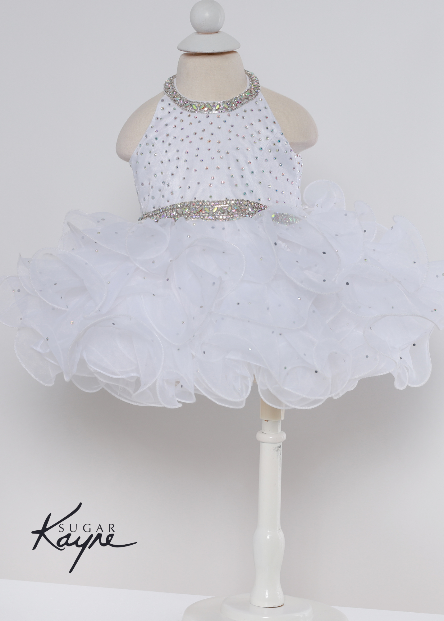 Sugar Kayne C220 Girls Baby Halter Cupcake Ruffle Pageant Dress Corset Formal Gown Have your little cupcake bring on all the charm in this stunning organza gown. The corset back is the perfect addition as the little one grows! Colors: Bubblegum, Neon Orange, White Sizes: 0M, 12M, 18M, 24M, 2T, 3T, 4T, 5T, 6M, 6T Fabric Organza, Satin Lining