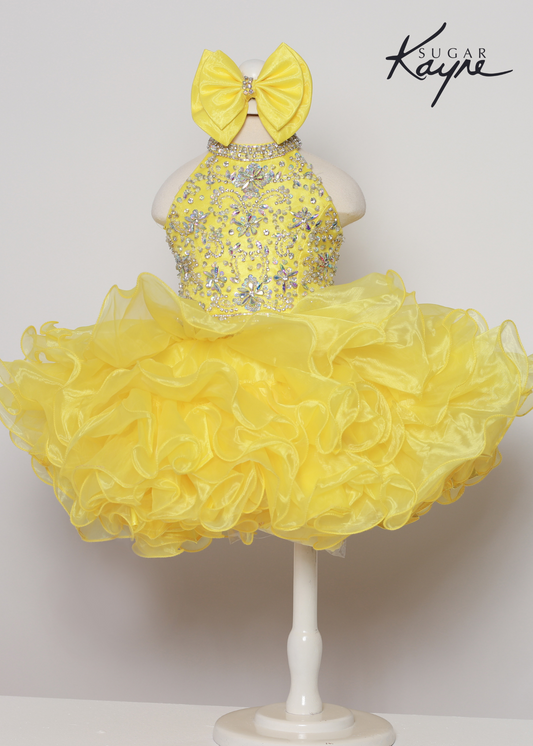 Sugar Kayne C223 Girls Baby Short ruffle Cupcake Pageant Dress Bow Halter Beaded Gown Have your little cupcake bring on all the charm in this stunning organza gown. The corset back is the perfect addition as the little one grows! Colors: Aqua, Petal Pink, Yellow Sizes: 0M, 12M, 18M, 24M, 2T, 3T, 4T, 5T, 6M, 6T Fabric Organza, Satin Lining
