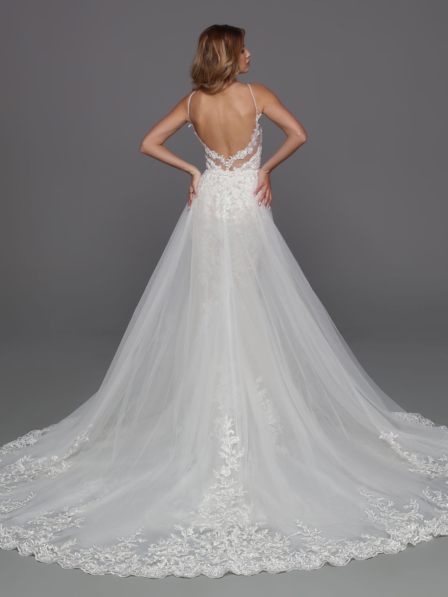 DaVinci Bridal 50720 Lace Wedding Dress Column Detachable Overskirt V Neckline Sheer Back This is a long beautiful wedding dress with a deep v neckline and sheer panel. The back is mid back and has sheer lace. It is a long column bridal gown with a long train.