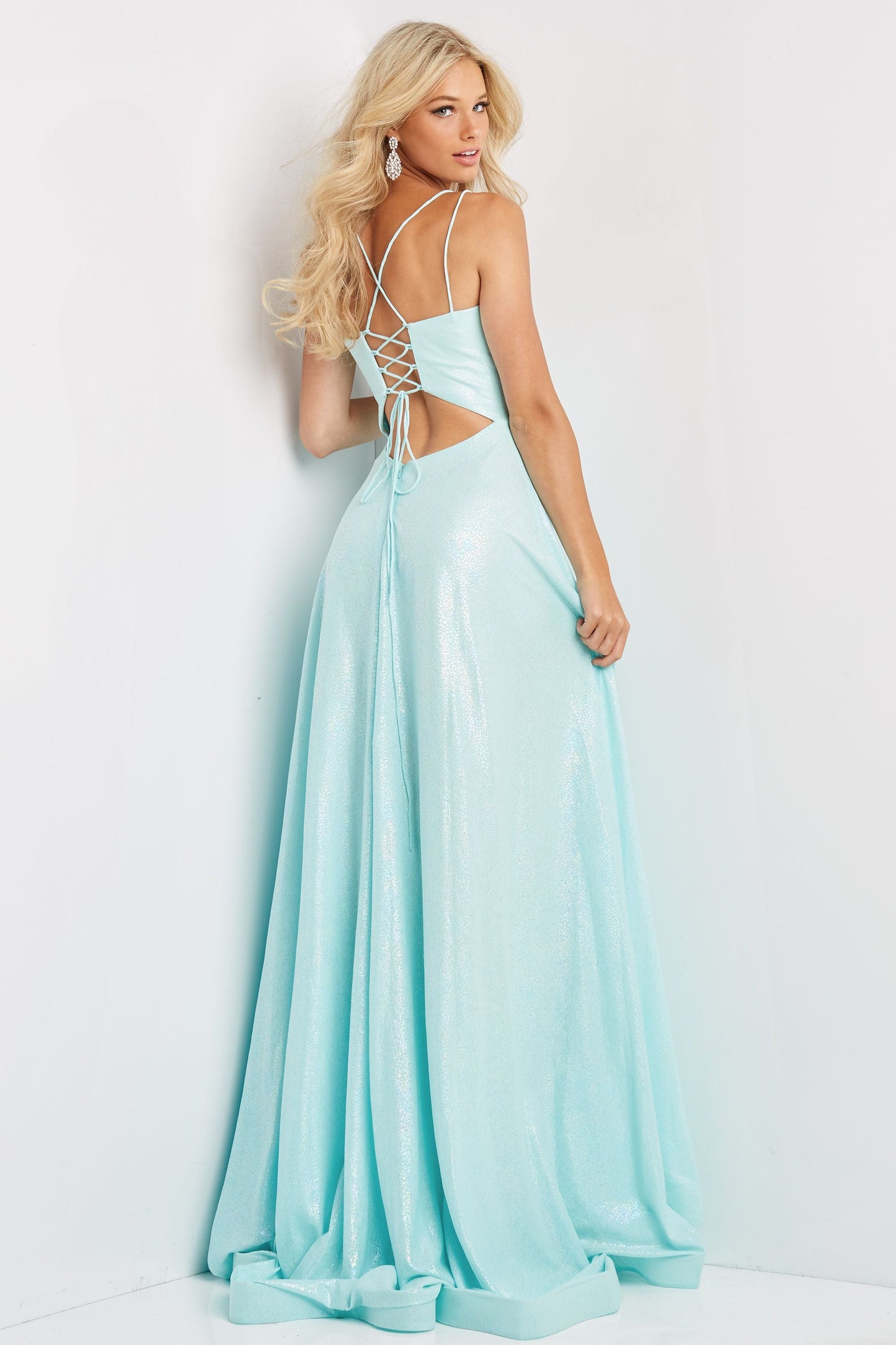 Jovani JVN08490 This is a JVN prom dress made by Jovani, JVN08490 is long party dress featuring an A-line silhouette with a V-neckline, held with double spaghetti straps that form the lace-up back. A contour waistband cinches this trendy prom gown, finished with a horsehair hem and sweep train. The corset in the back with cutouts helps lace up to fit you superb.