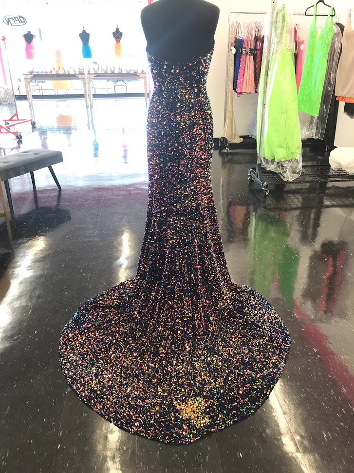 Johnathan Kayne 2529 Sequin Embellished stretch Velvet set off this top style! This Formal Pageant Dress features a high Slit and stage worthy Train! Sharp V Neckline shows this dress is on point! Sizes: 00, 0, 2, 4, 6, 8, 10, 12, 14, 16 Colors: Cotton Candy, Lemon Lime, Multi, Powder Blue, Orchid, Red, Royal