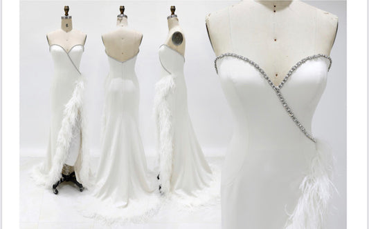 Jovani Couture S05819 Long Strapless Feather Slit Pageant Dress wedding Gown Bridal This Jovani S05819 off white wedding dress features a slim-flare silhouette with rhinestone trims along the strapless sweetheart neckline and semi-open back. Ostrich feathers trail down the thigh-high slit to the hem and sweep train. Available Sizes: 00,0,2,4,6,8,10,12,14 Available Colors: Off White