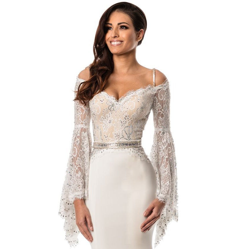 Johnathan Kayne 7244 is an off the shouler bell sleeve Prom Dress, Pageant Gown & Formal Evening Wear. One of the Best-Sellers from our new collection, this A/B encrusted stretch lace bell sleeve gown is so fresh and feminine. The stretch ponte knit skirt is comfortable and flattering on all silhouettes and flows into a small train.