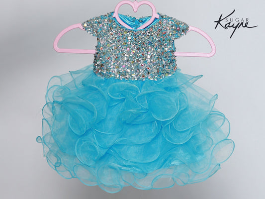 Sugar Kayne C201 Girls Ruffle Cupcake Pageant Dress Crystal Bodice Cap Sleeve Gown Sizes: 0M, 6M, 12M, 18M, 24M, 2T, 3T, 4T, 5T, 6T Colors: Turquoise, White, Bubblegum