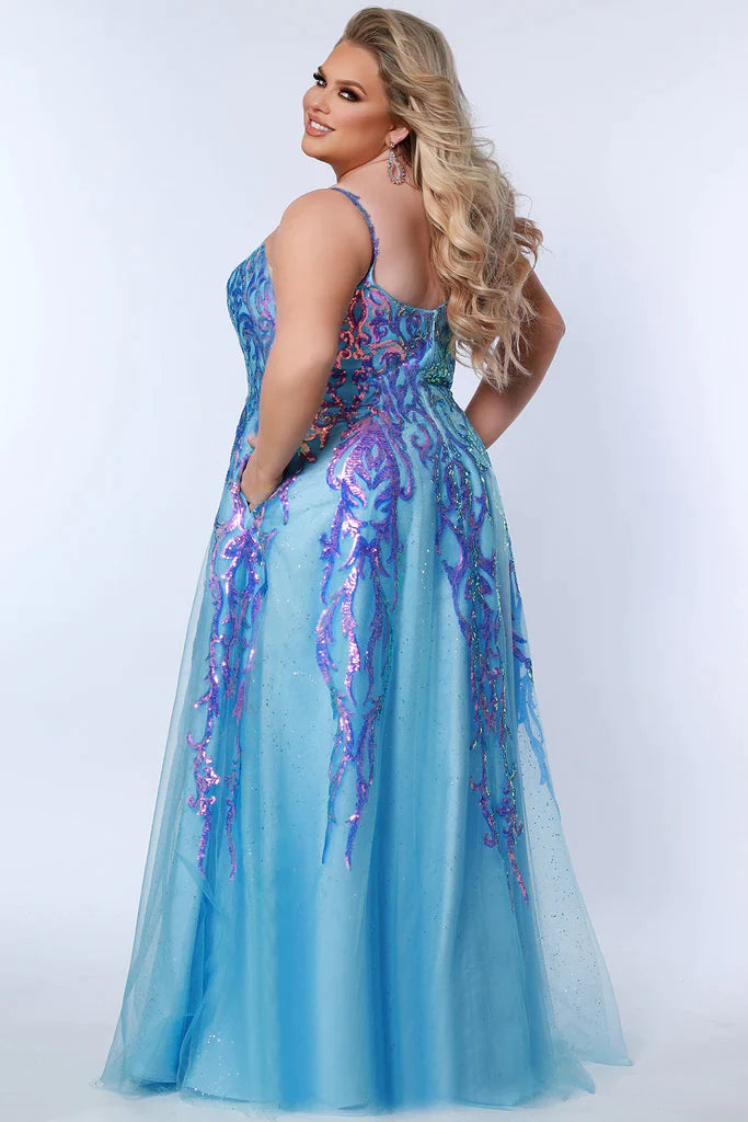 Sydney's Closet Tease Prom TE2302 Long Sequin Shimmer A Line Prom Dress Plus Size Slit Gown Colors: Jade, Magenta, Sky Size: 14-32 A-line silhouette Sequin appliques on net over glitter tulle V-neckline Tone-on-tone glitter mesh net Straps = ½ inch covered in appliques Center back zipper Slim A-line skirt Slit starts at 16 inches down from the waist seam Satin lining