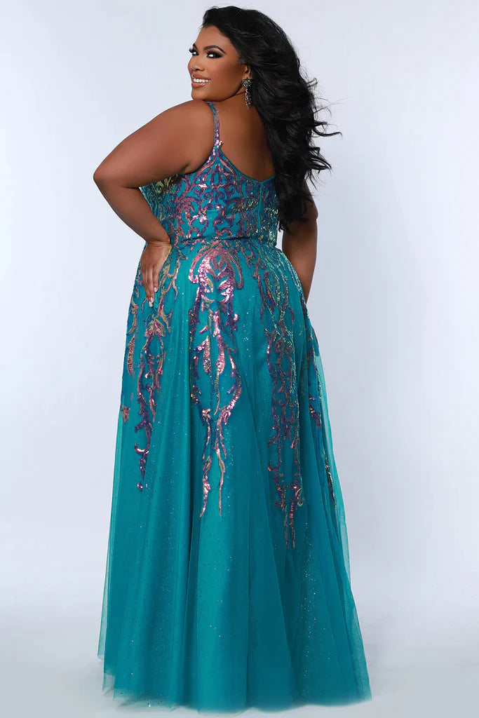 Sydney's Closet Tease Prom TE2302 Long Sequin Shimmer A Line Prom Dress Plus Size Slit Gown Colors: Jade, Magenta, Sky Size: 14-32 A-line silhouette Sequin appliques on net over glitter tulle V-neckline Tone-on-tone glitter mesh net Straps = ½ inch covered in appliques Center back zipper Slim A-line skirt Slit starts at 16 inches down from the waist seam Satin lining