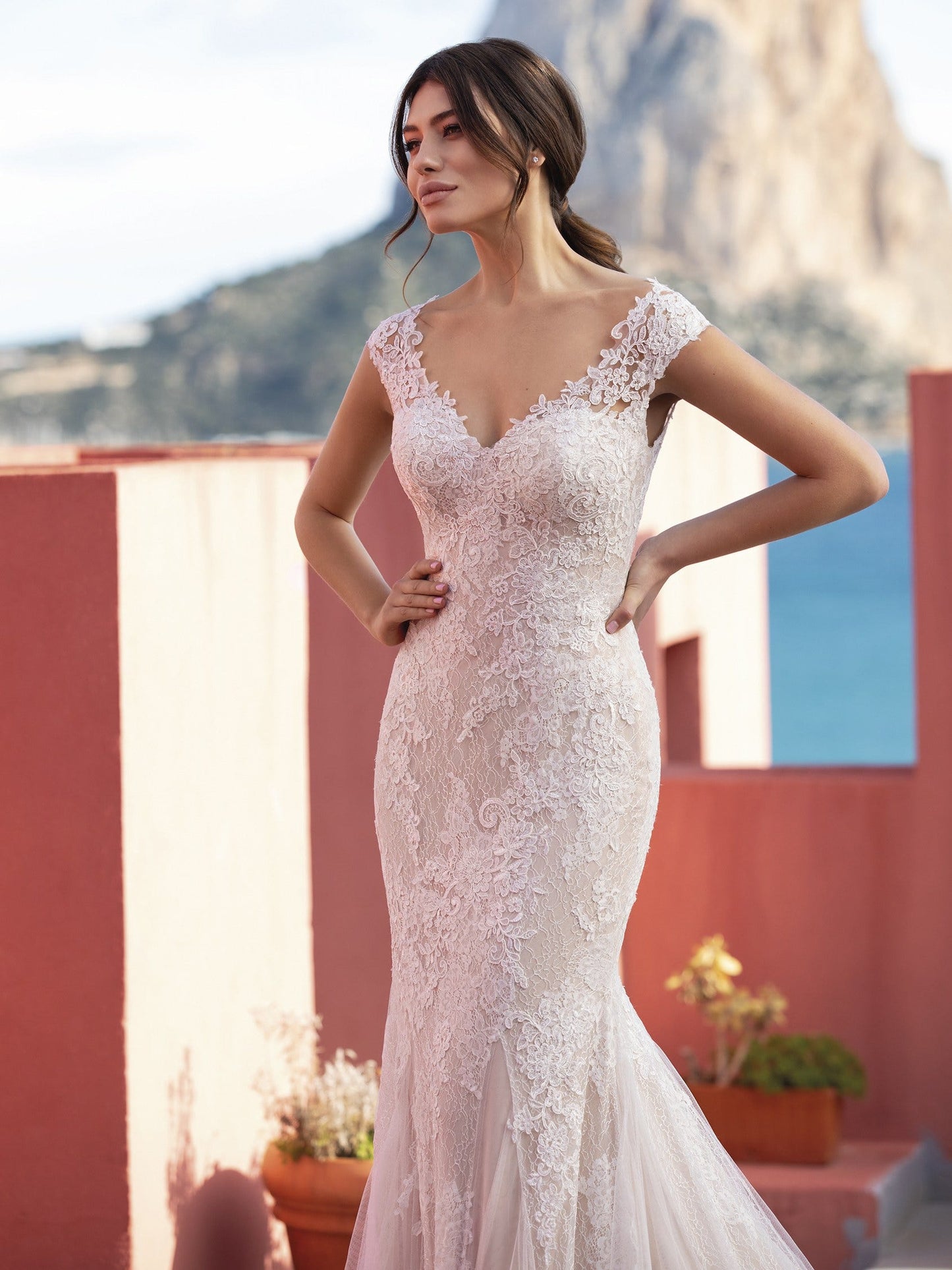 Pronovias White One Bridal CICELY  Gorgeous embroidered tulle lends a romantic, heirloom look to this sensual mermaid dress that flatters curves in all the right places. With a sexy illusion back and chapel train with a scalloped edge.  Silhouette / Cut Mermaid Neckline V-neck