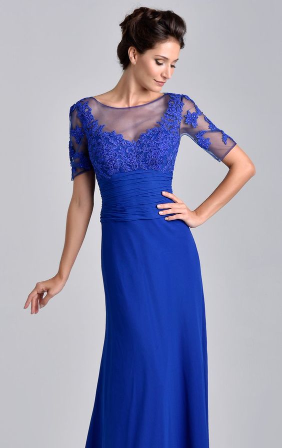 Nina Canacci M202 has a bateau neckline and mid-arm length sleeves. Appealing patterns of lace appliques scatter over the sheer bust and onto the sleeves. Tiny beads glitter the appliques. A ruched band wraps the midriff and the long skirt falls perfectly leaving a floor-length hemline. Sheer floral lace high neckline & 2/3 sheer embellished sleeves. Mother of dress, wedding guest & More Available Sizes: 6 Available Color: Royal (Cobalt)