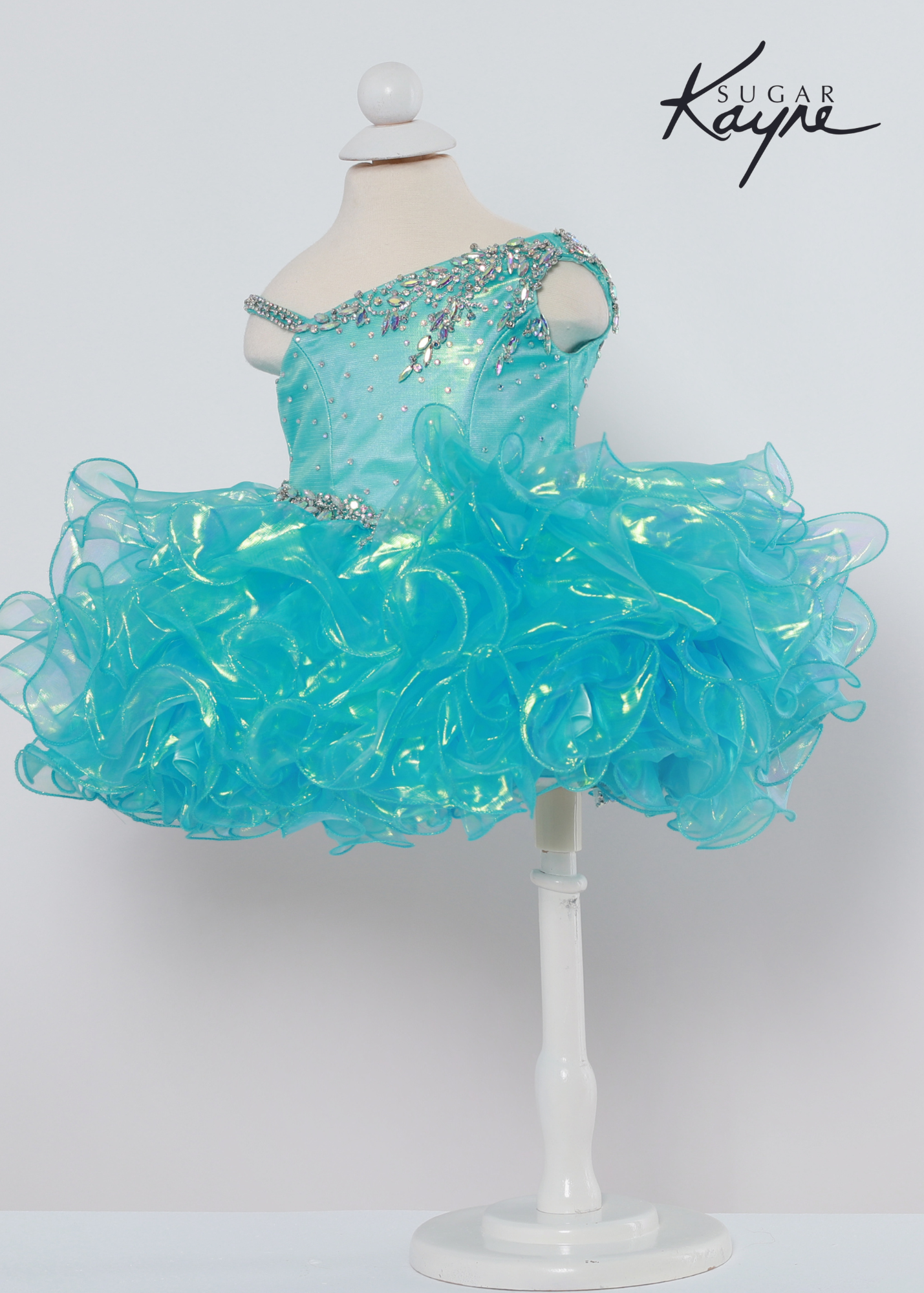 Sugar Kayne C214 iridescent organza gown with a corset back Available sizes: 0M,6M,12M,18M,24M,2T,3T,4T,5T,6T Available Colors: Aqua, Lemon Lime, Pink