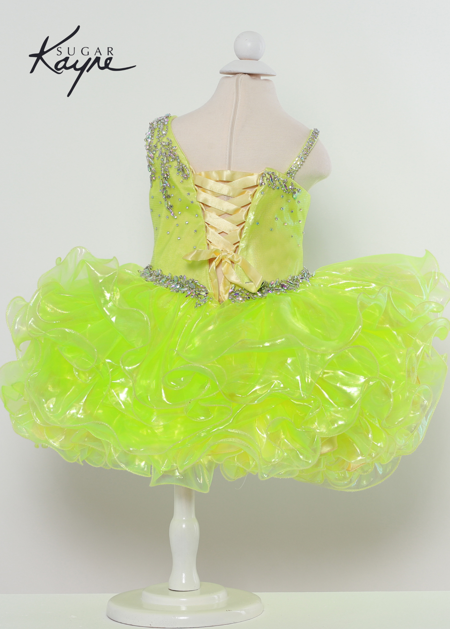 Sugar Kayne C214 iridescent organza gown with a corset back Available sizes: 0M,6M,12M,18M,24M,2T,3T,4T,5T,6T Available Colors: Aqua, Lemon Lime, Pink