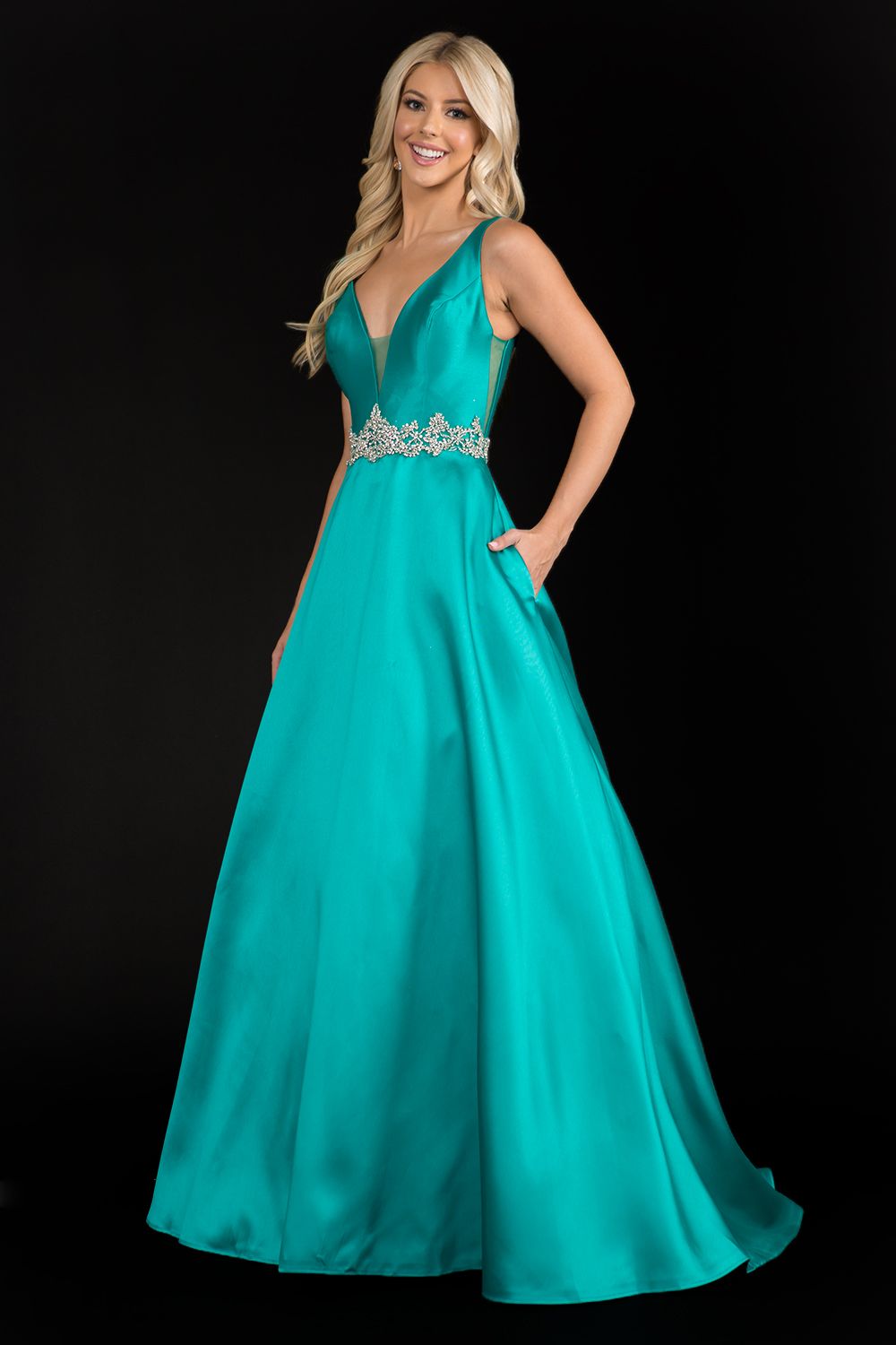 Nina Canacci 2297 plunging neckline A line prom dress formal evening gown with an embellished waistline. Perfect for a wedding dress in Ivory. Color: Ivory, Emerald, Royal Sizes: 8,10,12,14,16, 18, 20, 22, 24