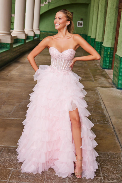 Enhance your elegance with the Nox Anabel R1688 Lace Corset Ruffle A Line Prom Dress. Featuring a strapless design and intricate lace corset, this formal dress boasts a maxi slit and layered ballgown style for a graceful look. Perfect for prom or other formal events, this dress is sure to turn heads.

Sizes: 00-16

Colors: Light Blue, Pink