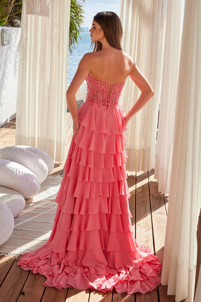 Be the belle of the ball in the Nox Anabel Y1551 formal gown. This size 4 dress features a candy pink corset top with delicate ruffles and a sheer slit skirt adorned with sequin lace. The strapless design adds a touch of sophistication to this stunning prom dress. Perfect for any formal event. STEP INTO A WORLD OF ENCHANTMENT WITH OUR EXQUISITE LONG CHIFFON DRESS. THIS STUNNING GOWN FEATURES A SEMI-TRAIN FOR ADDED DRAMA AND FLAIR, PERFECT FOR MAKING A GRAND ENTRANCE AT ANY EVENT. THE LAYERED CHIFFON SKIRT F