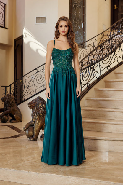 Make a statement in this stunning Nox Anabel A1725 prom dress, designed for those who dare to stand out. The sheer sequin corset bodice catches light with every movement, while the backless silhouette offers modern elegance and allure. Delicate spaghetti straps provide support, and the flowing A-line skirt with train creates a dramatic, graceful silhouette. Perfect for prom, formal events, or any occasion calling for show-stopping glamour.

Sizes: 00-16


Colors: Emerald, Royal Blue
