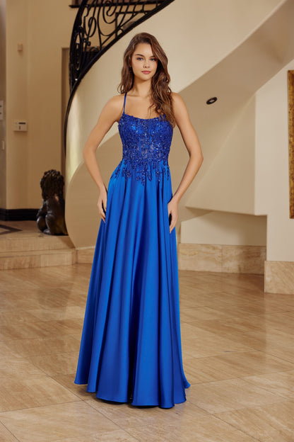 Make a statement in this stunning Nox Anabel A1725 prom dress, designed for those who dare to stand out. The sheer sequin corset bodice catches light with every movement, while the backless silhouette offers modern elegance and allure. Delicate spaghetti straps provide support, and the flowing A-line skirt with train creates a dramatic, graceful silhouette. Perfect for prom, formal events, or any occasion calling for show-stopping glamour.

Sizes: 00-16


Colors: Emerald, Royal Blue