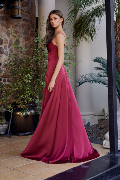 Elevate your formal moment in this stunning Nox Anabel A1744 satin gown. Featuring a sculpted corset bodice that flatters and supports, a graceful train for dramatic impact, and a scoop neckline that balances elegance with allure. The strategic slit adds modern sophistication to this pageant-ready design. Perfect for prom, pageants, or any black-tie occasion where you want to make an unforgettable entrance. Crafted from luxurious satin for a refined, polished finish.

Sizes: 00-16


Colors: Black, Burgundy,