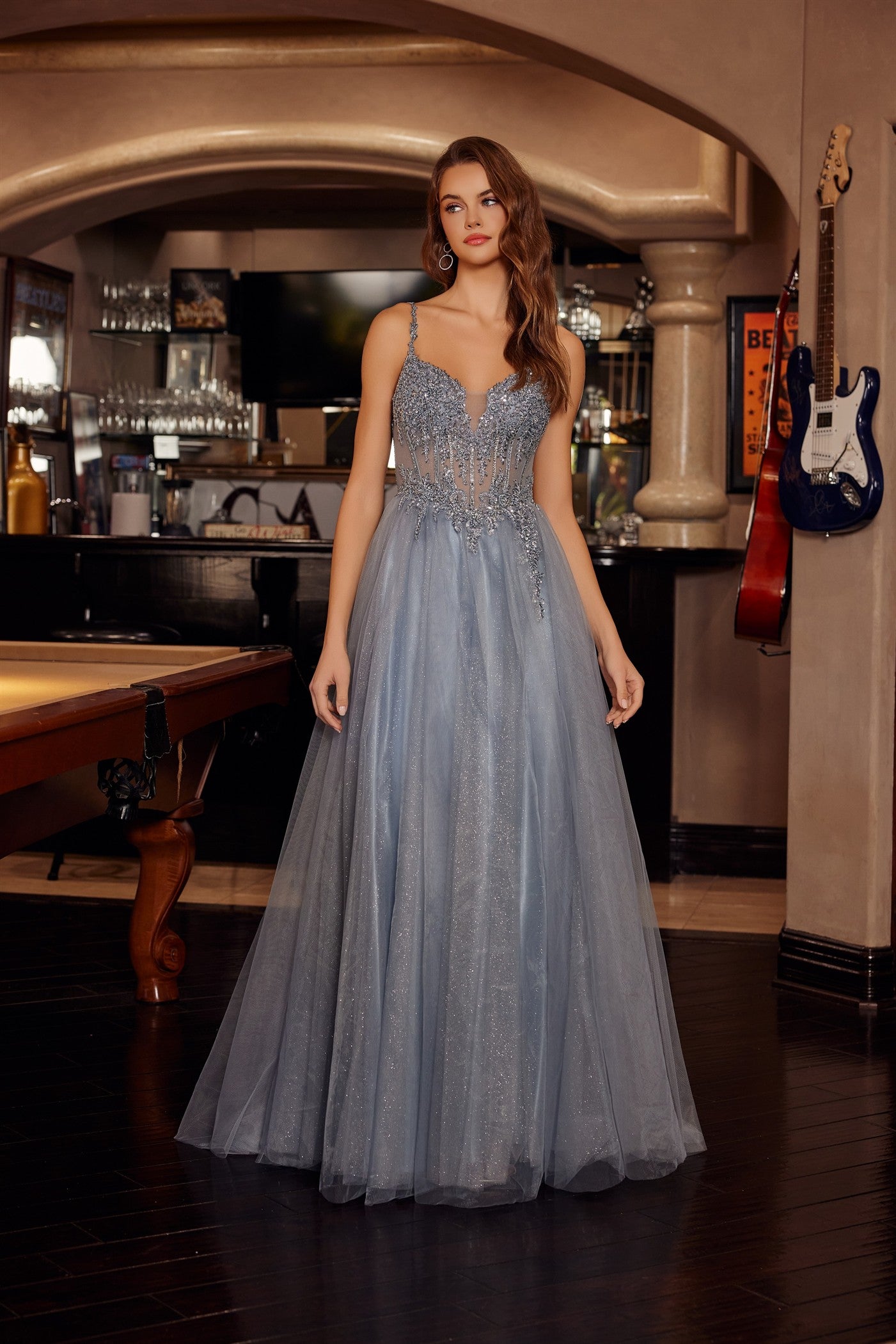 Make a statement in this Nox Anabel F1726 prom dress, featuring a sheer sequin corset bodice that catches the light with every movement. The structured A-line silhouette flatters your figure while the plunging V-neckline adds sophisticated allure. A graceful train completes the look with timeless elegance. Perfect for prom night or formal events where you want to feel confident and radiant.

Sizes: 00-16


Colors: Champagne, Greenery, Silver, Smoky Blue
