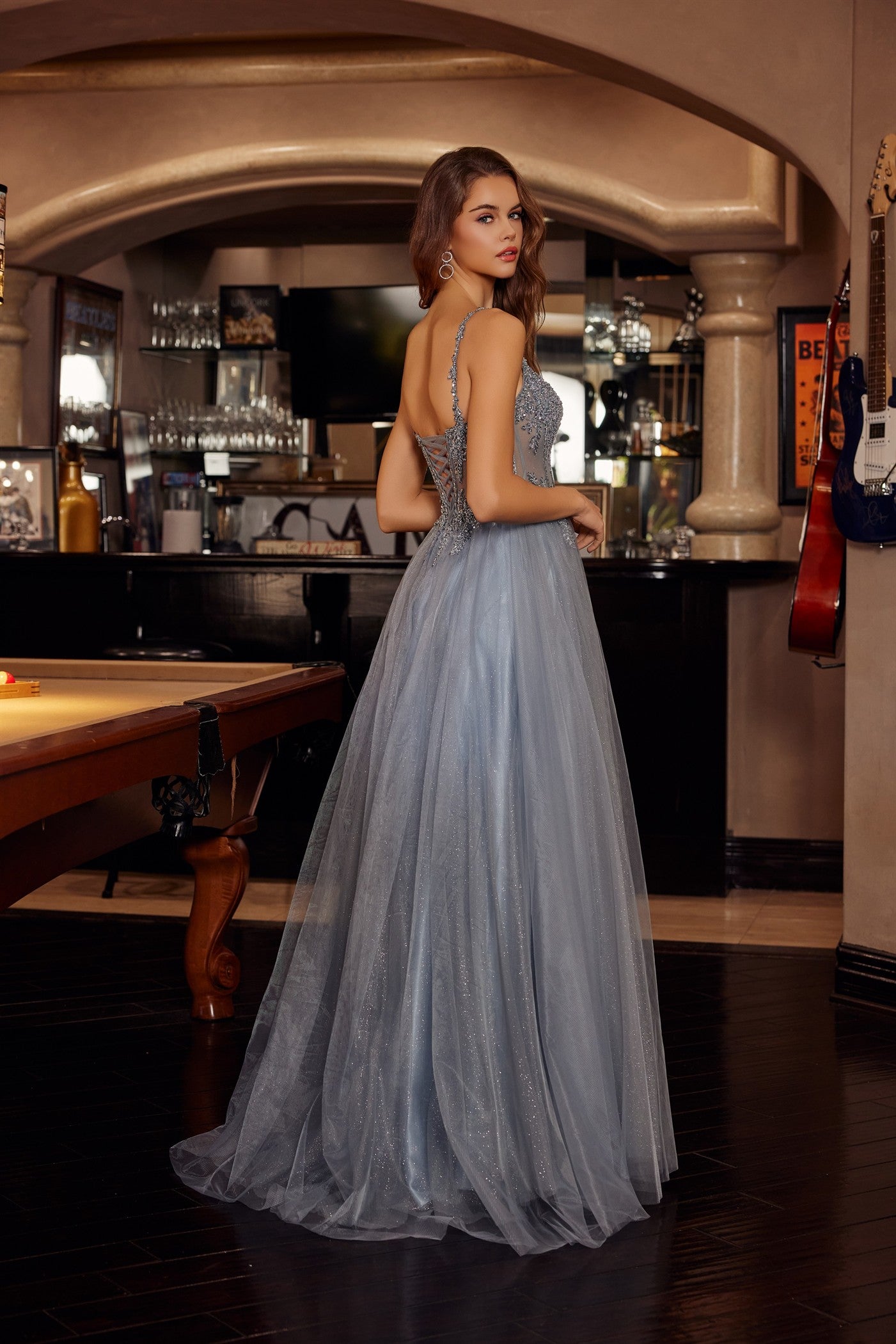 Make a statement in this Nox Anabel F1726 prom dress, featuring a sheer sequin corset bodice that catches the light with every movement. The structured A-line silhouette flatters your figure while the plunging V-neckline adds sophisticated allure. A graceful train completes the look with timeless elegance. Perfect for prom night or formal events where you want to feel confident and radiant.

Sizes: 00-16


Colors: Champagne, Greenery, Silver, Smoky Blue