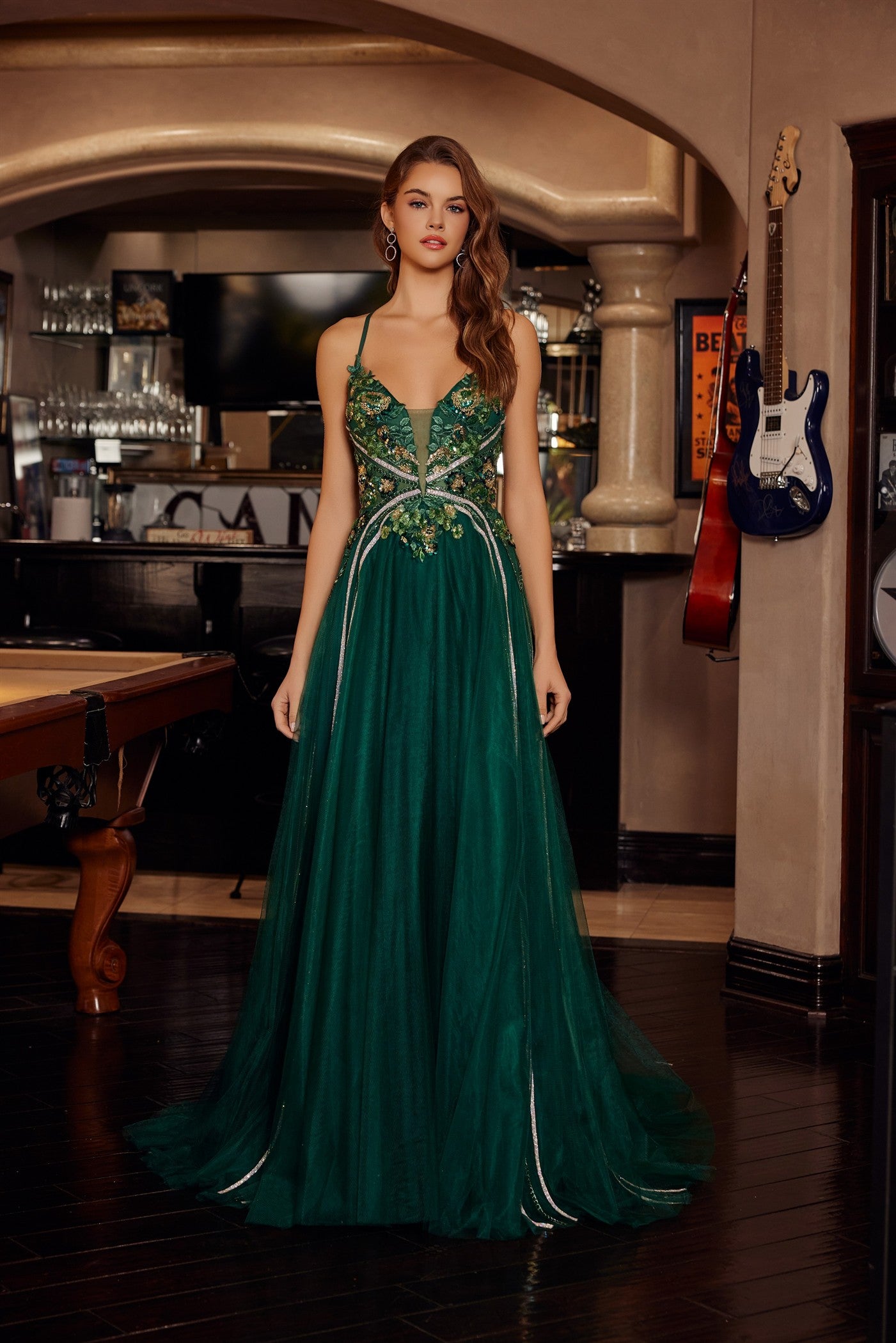 Nox Anabel's G1795 prom dress commands attention with its daring plunging V-neckline and sheer sequin corset bodice that catches light from every angle. Delicate spaghetti straps frame the shoulders while the backless design creates an elegant, modern silhouette. A graceful train adds dramatic movement and sophistication to your entrance. Perfect for prom, formal galas, or black-tie events where you want to make a memorable impression. This statement piece combines intricate beading with refined tailoring f