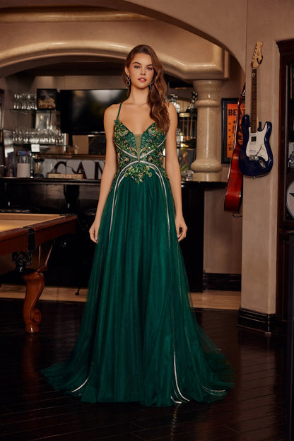 Nox Anabel's G1795 prom dress commands attention with its daring plunging V-neckline and sheer sequin corset bodice that catches light from every angle. Delicate spaghetti straps frame the shoulders while the backless design creates an elegant, modern silhouette. A graceful train adds dramatic movement and sophistication to your entrance. Perfect for prom, formal galas, or black-tie events where you want to make a memorable impression. This statement piece combines intricate beading with refined tailoring f