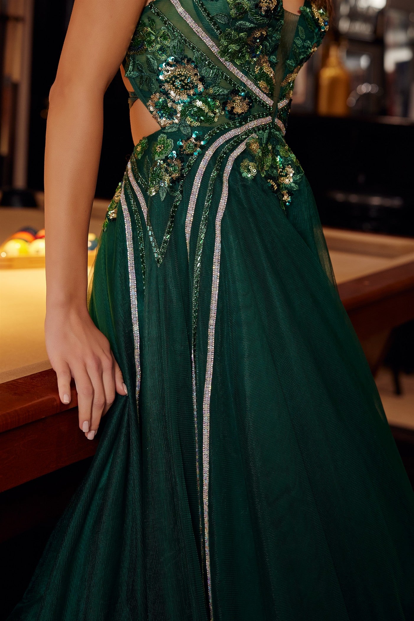Nox Anabel's G1795 prom dress commands attention with its daring plunging V-neckline and sheer sequin corset bodice that catches light from every angle. Delicate spaghetti straps frame the shoulders while the backless design creates an elegant, modern silhouette. A graceful train adds dramatic movement and sophistication to your entrance. Perfect for prom, formal galas, or black-tie events where you want to make a memorable impression. This statement piece combines intricate beading with refined tailoring f