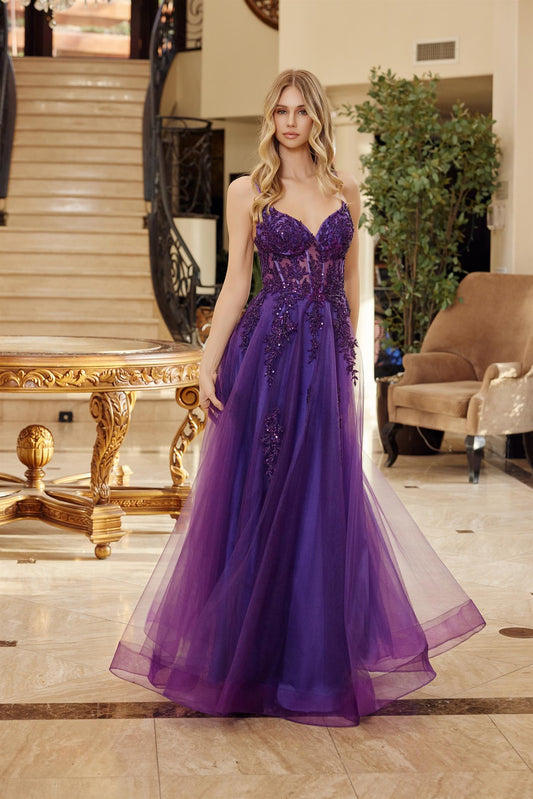 Make a statement in this stunning Nox Anabel Q1778 prom dress, designed for those who embrace bold elegance. The sheer beaded corset bodice creates a captivating silhouette with intricate detailing, while the sweetheart neckline flatters every frame. Delicate spaghetti straps provide graceful support, and the backless design adds an alluring touch of sophistication. A dramatic train completes the look, ensuring you'll turn heads all night long. Perfect for prom, formal events, or any occasion calling for sh
