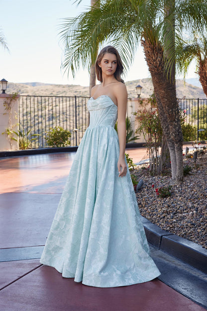 Nox Anabel's T1912 strapless prom dress combines timeless elegance with modern glamour. The structured A-line silhouette flatters every figure, while the crystal-embellished corset bodice adds sophisticated sparkle. A sweetheart neckline frames the shoulders beautifully, and the dramatic train creates a show-stopping entrance. Perfect for prom, formal galas, or black-tie events where you want to make an unforgettable impression.

Sizes: 00-16

Colors: Lilac, Sage Green, Yellow