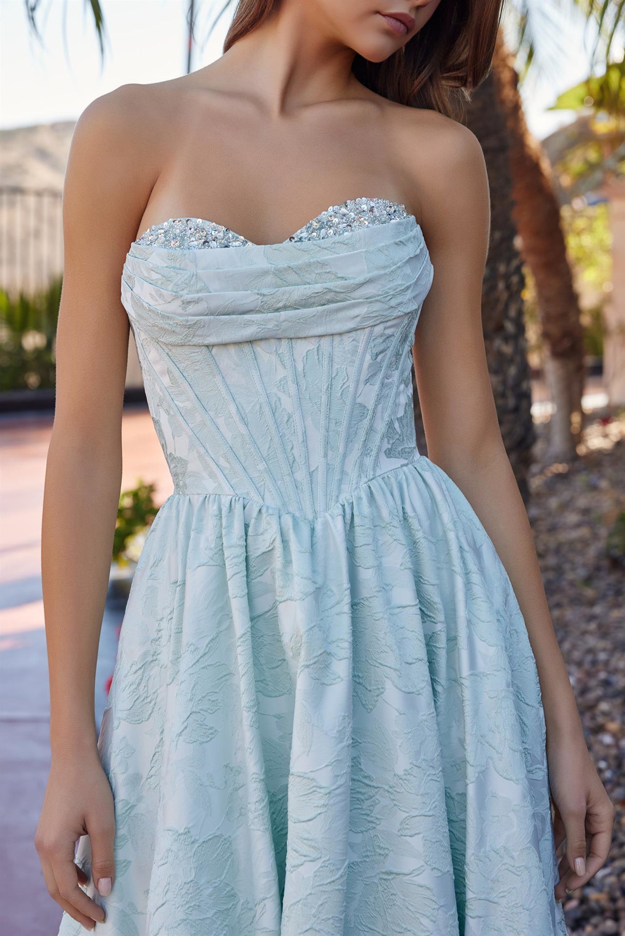 Nox Anabel's T1912 strapless prom dress combines timeless elegance with modern glamour. The structured A-line silhouette flatters every figure, while the crystal-embellished corset bodice adds sophisticated sparkle. A sweetheart neckline frames the shoulders beautifully, and the dramatic train creates a show-stopping entrance. Perfect for prom, formal galas, or black-tie events where you want to make an unforgettable impression.

Sizes: 00-16

Colors: Lilac, Sage Green, Yellow